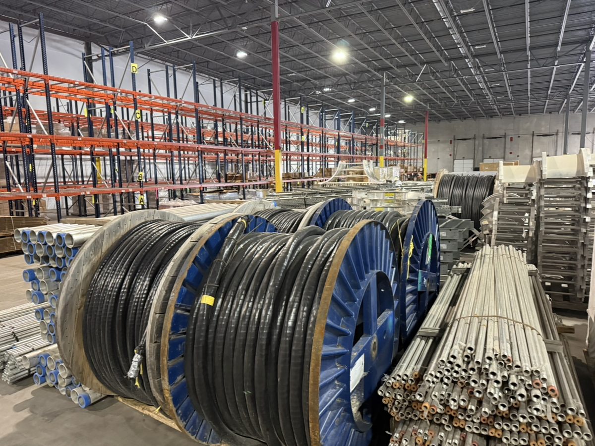 Industrial warehouse full of surplus cable reels and electrical materials we purchased